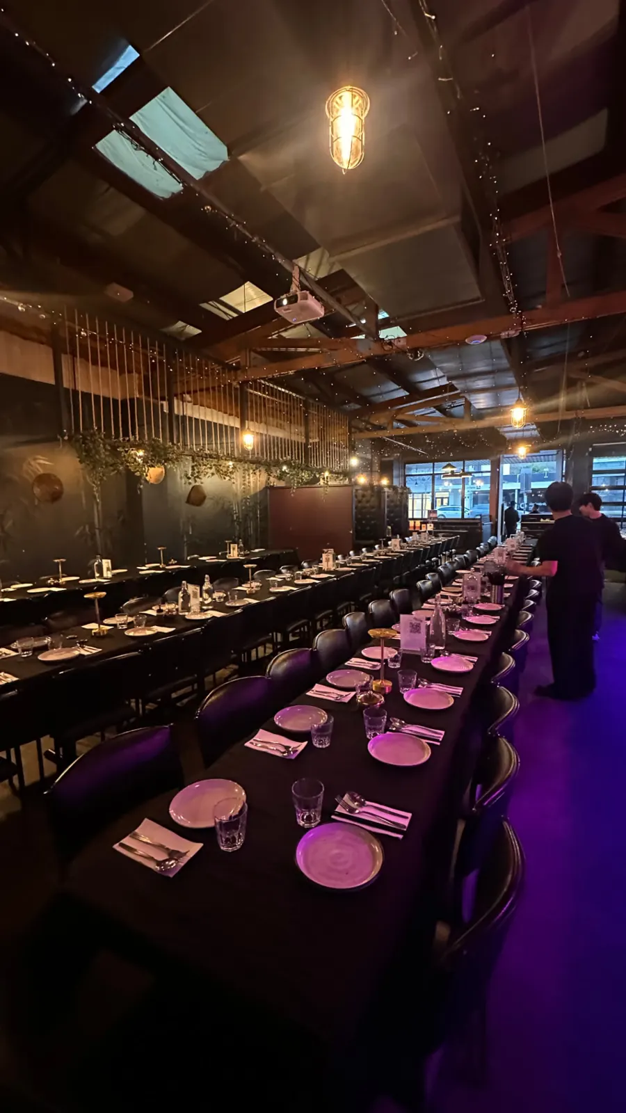 The whole venue set with long tables for an exclusive booking
